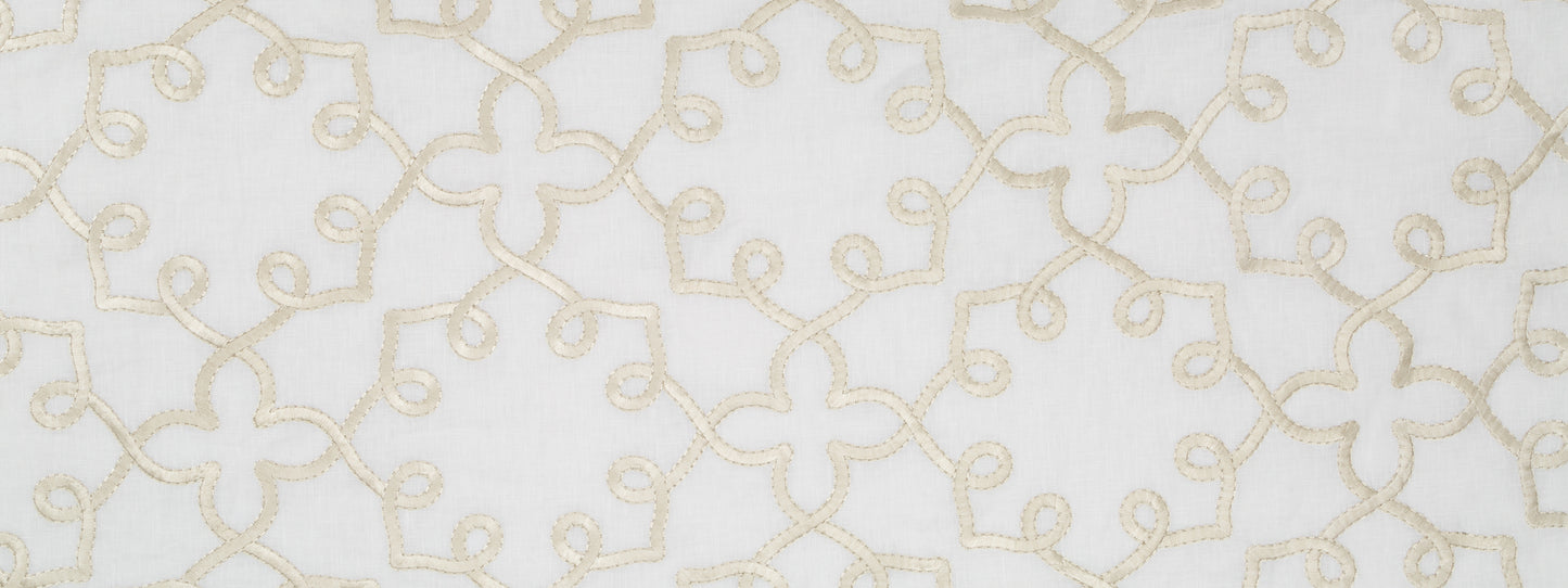 Cream embroidered looping pattern on white fabric; linen-like textile suitable for curtains or table runner.