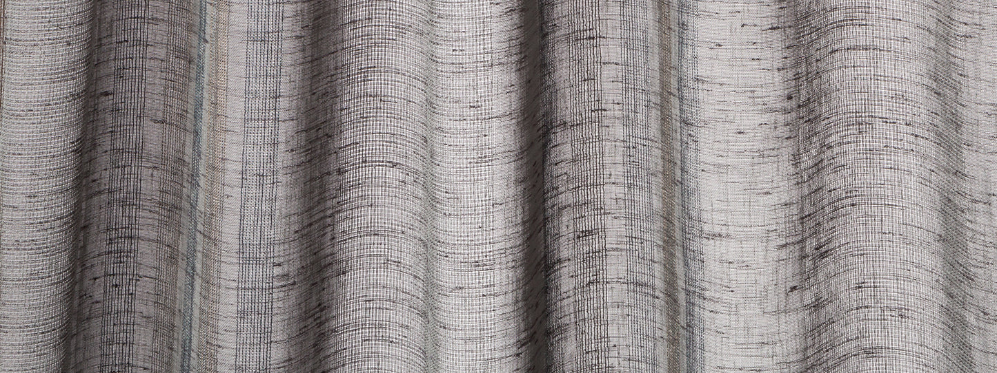 Indigo linen-look curtain panels with textured weave and soft vertical folds.