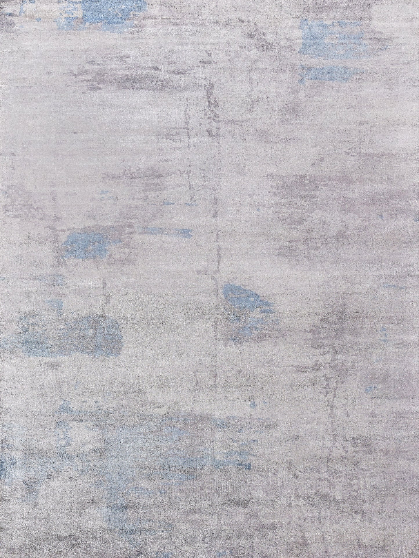 Light gray area rug with abstract designs in soft blue and silver tones, featuring a textured and contemporary style.