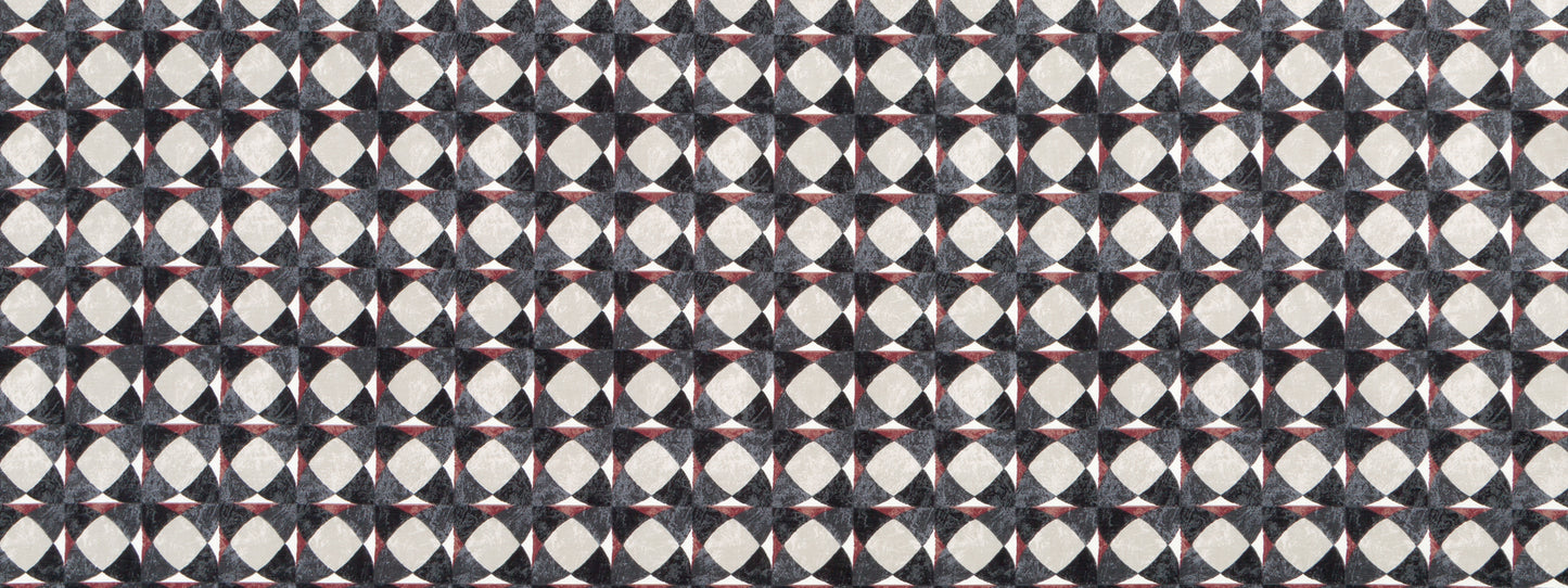 Geometric tessellated pattern in graphite with circular motifs repeating on a dark background.