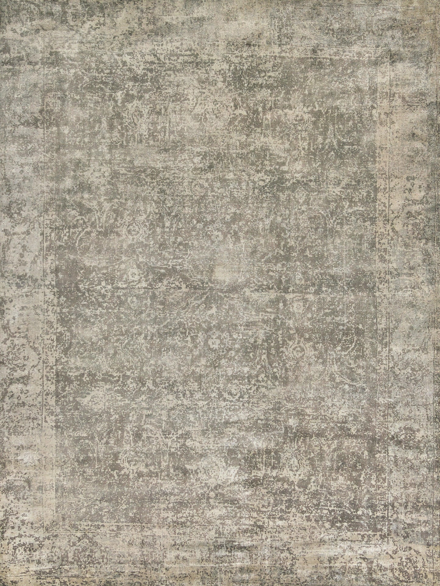 Abstract gray and cream patterned handloomed rectangle rug with a distressed vintage look, providing a neutral and elegant touch to any space.