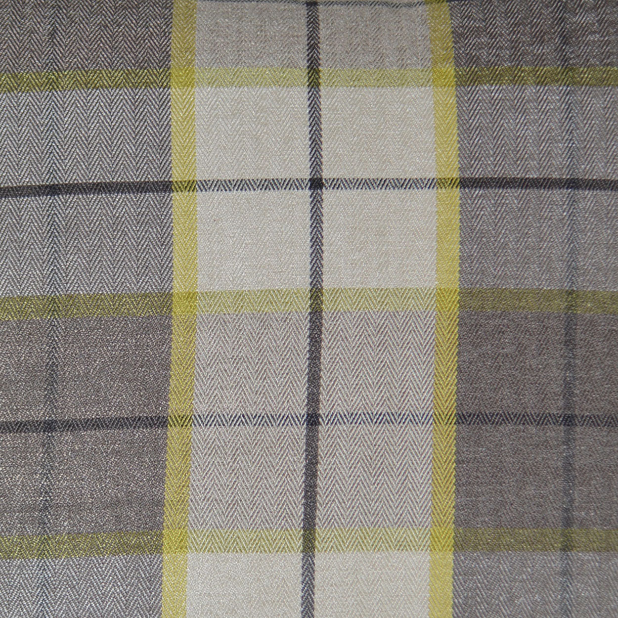 Plaid fabric in beige, gray and lime-green with a herringbone weave, ideal for upholstery or apparel.