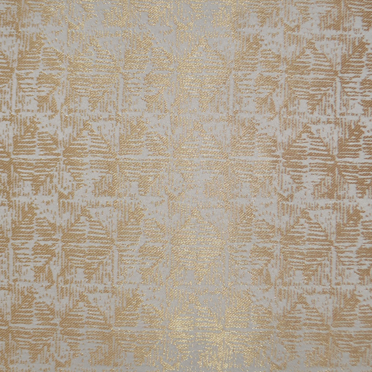 Cream fabric with gold metallic damask jacquard pattern, ornate floral motifs and woven texture.