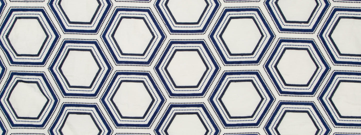 Geometric hexagon lattice in navy and light blue double lines on white background, repeating pattern for wallpaper or fabric.