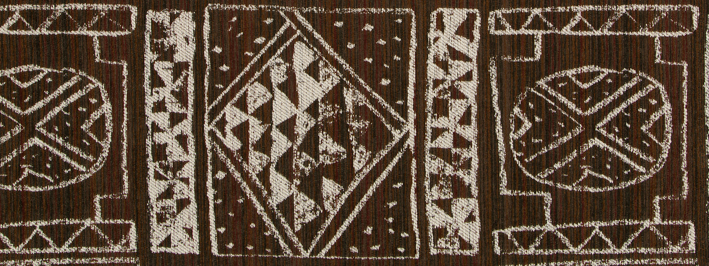 Brown woven upholstery fabric with white geometric tribal motifs featuring diamonds and triangles, textured textile decor.