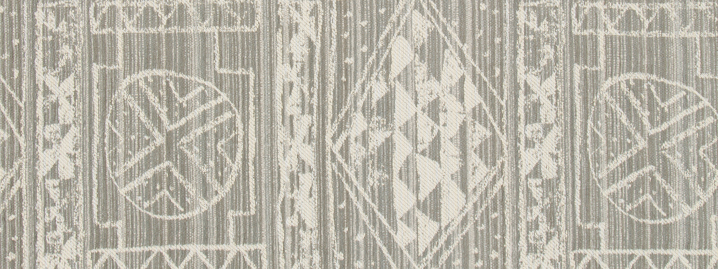 Beige upholstery fabric with cream geometric medallions, diamonds and circles in a boho kilim-inspired pattern.