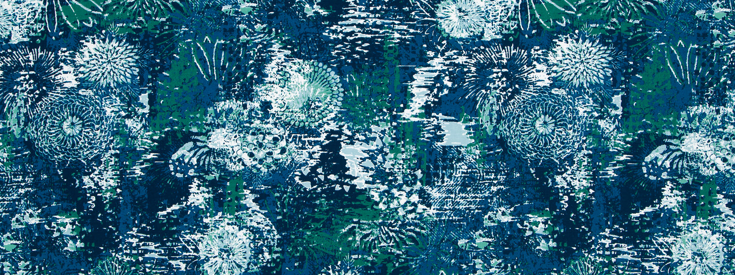 Teal and navy floral print fabric with white daisy motifs; bold botanical pattern for clothing or home decor.