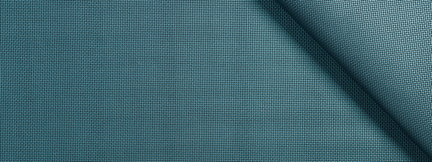 Teal blue woven fabric with fine texture and a diagonal fold; ideal for upholstery, cushions or curtains.