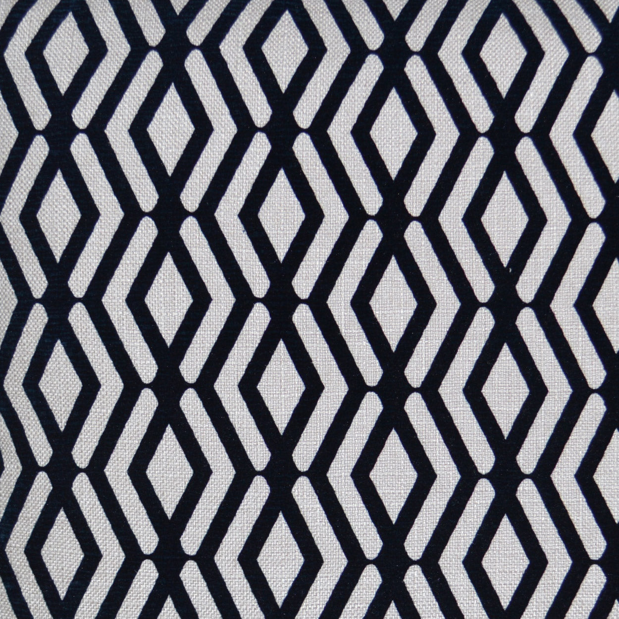 Navy and white geometric diamond lattice pattern on a 24 x 24 inch pillow.