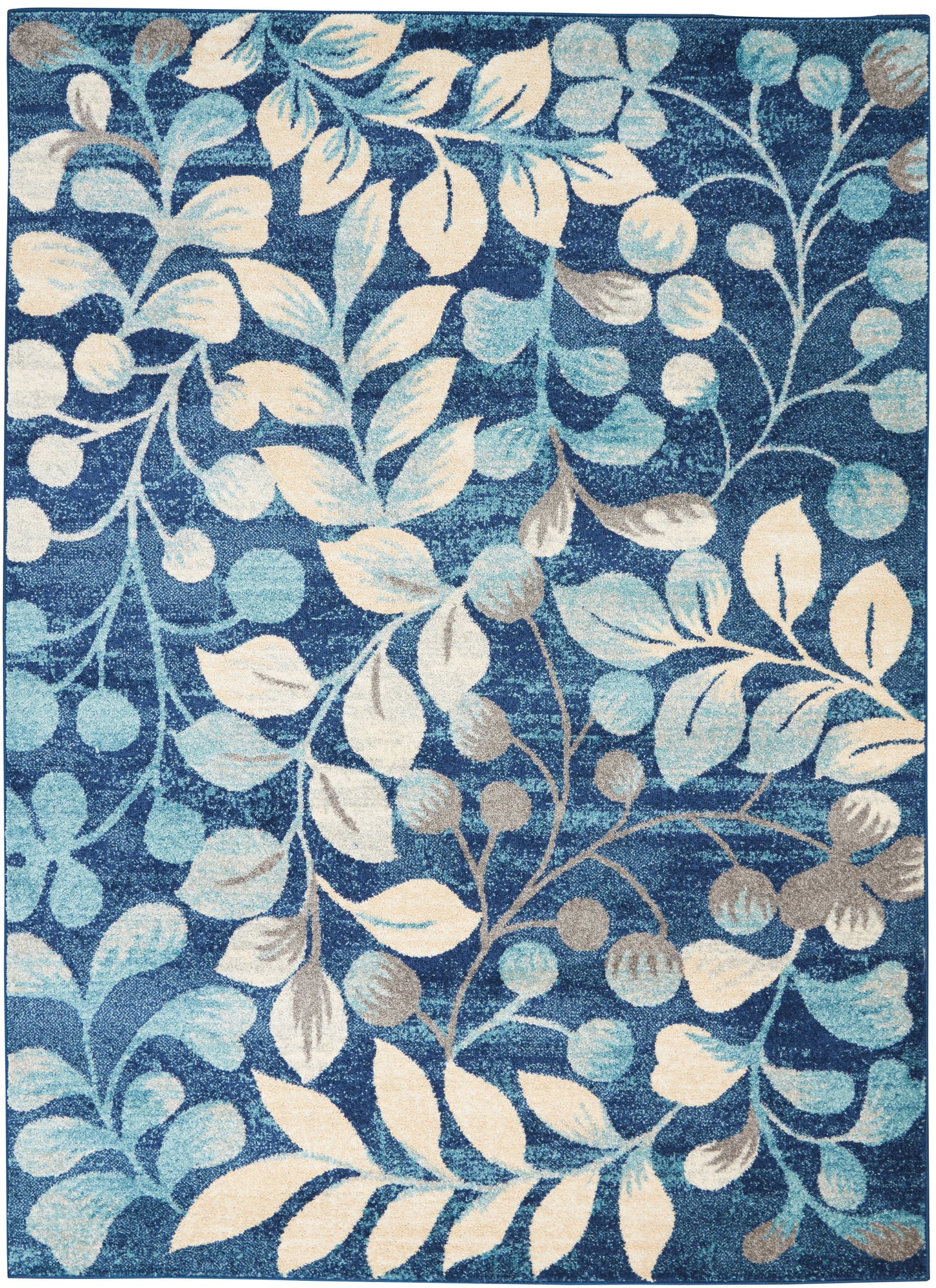 Blue rectangular rug with cream and pale teal botanical leaves and vines on a deep blue background; decorative living room rug.