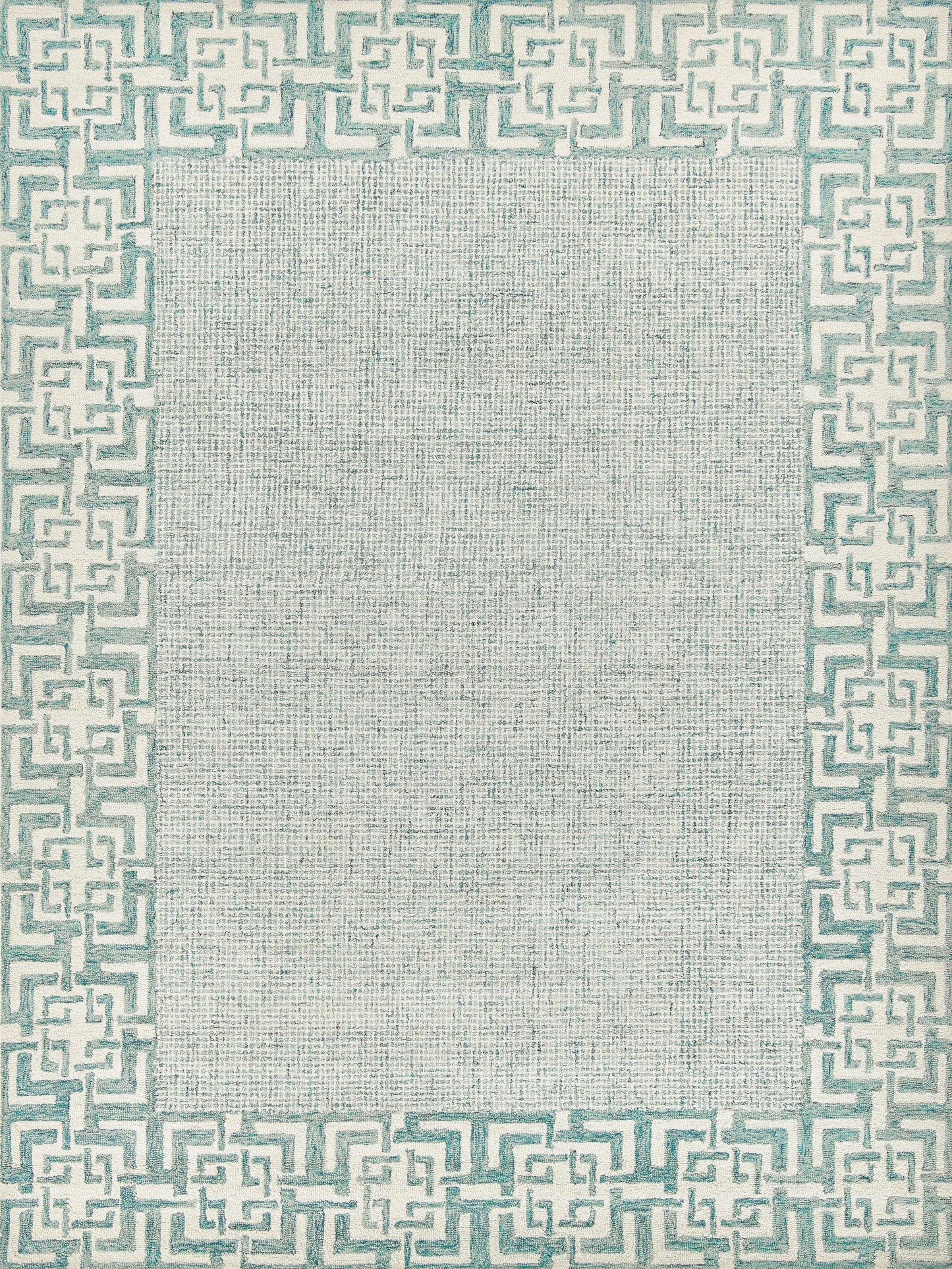 Beige textured rug with a teal Greek-key border around a plain center.