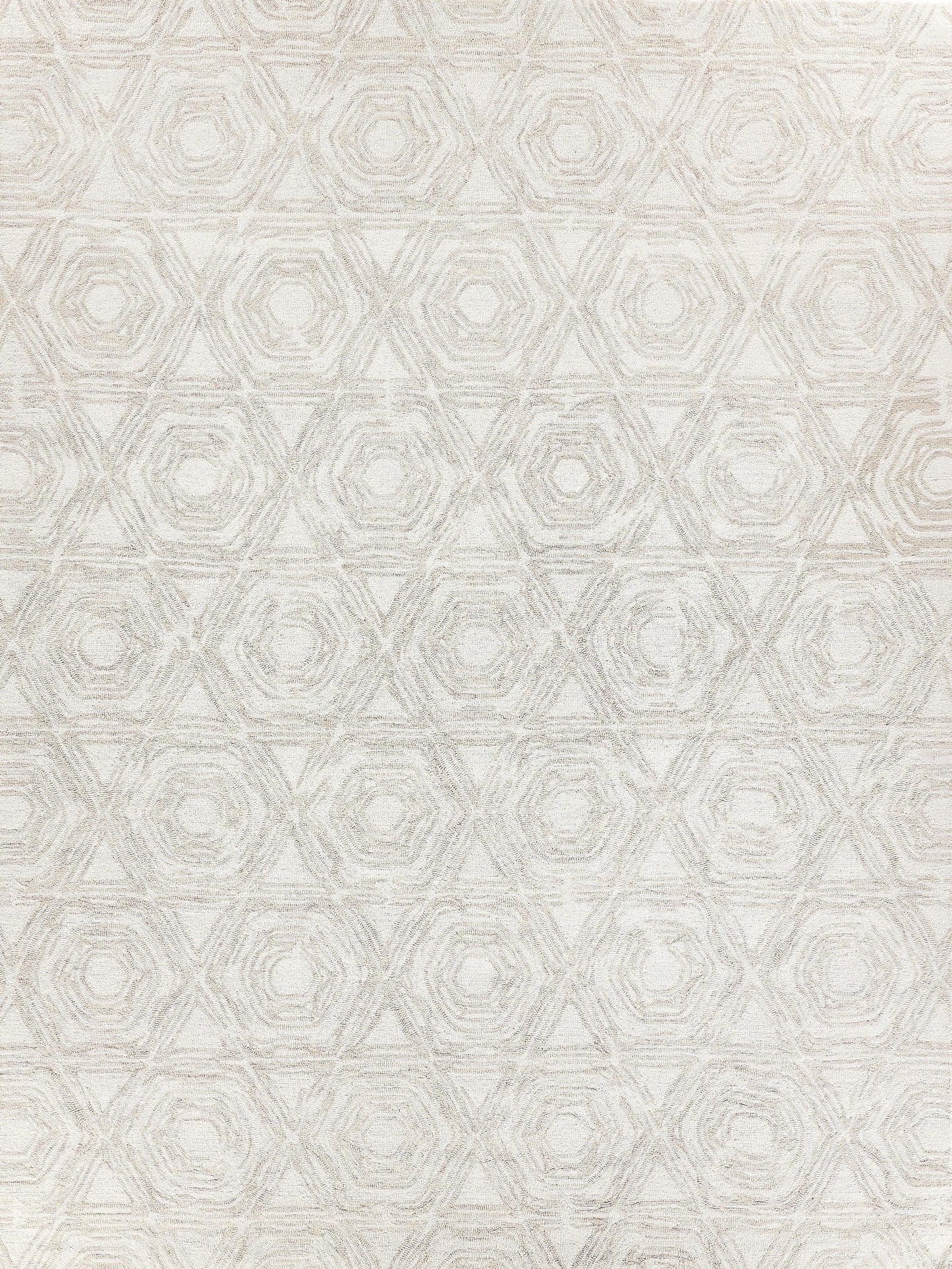 Light beige rug featuring a hexagonal pattern with textured detailing, ideal for adding a modern touch to any space.