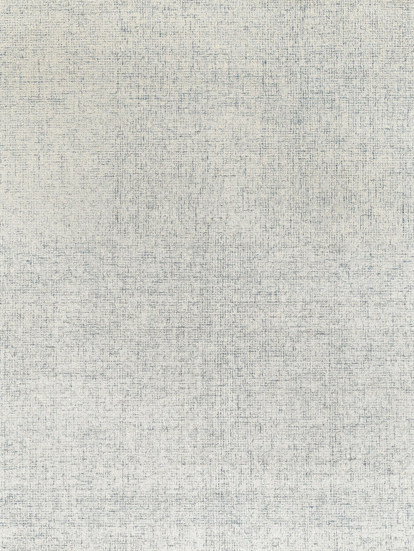 Light beige hand-tufted rectangular rug with a textured surface and subtle blue and gray threads woven throughout.