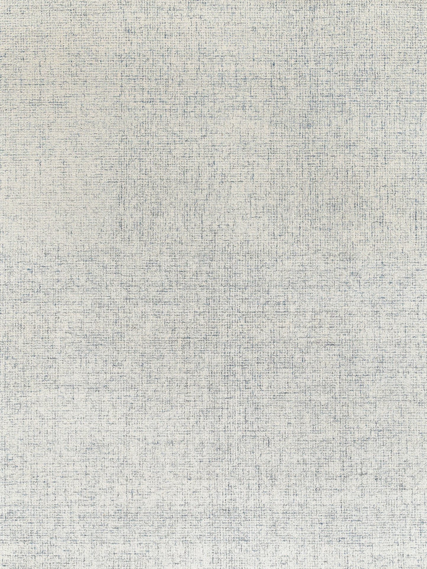 Light beige hand-tufted rectangular rug with a textured surface and subtle blue and gray threads woven throughout.