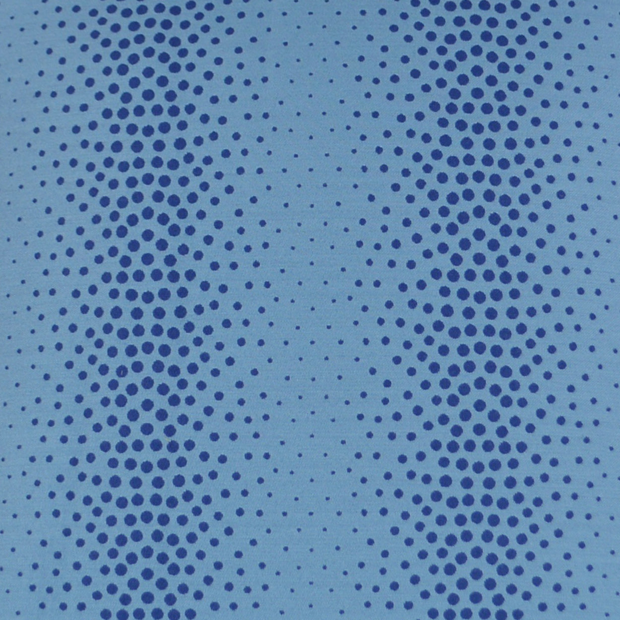 Azure abstract pillow with blue halftone dotted pattern; light blue base with darker blue circular dots forming curved vertical stripes.