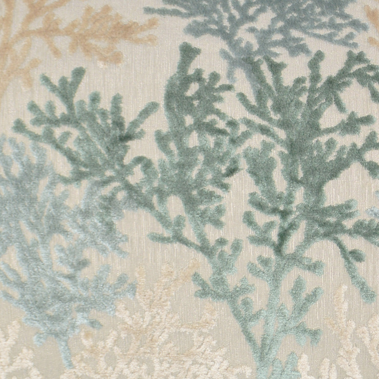 Coral-branch patterned fabric in teal blue and sandy beige on cream; linen-like textile ideal for upholstery or drapery.