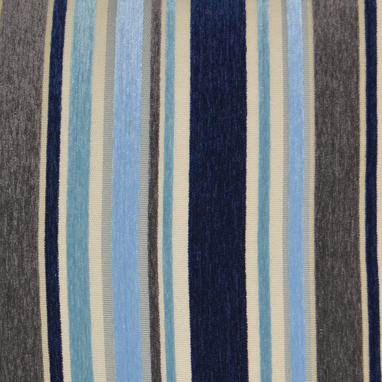 Blue striped pillow with navy, sky blue, light blue, beige and gray stripes on woven fabric.