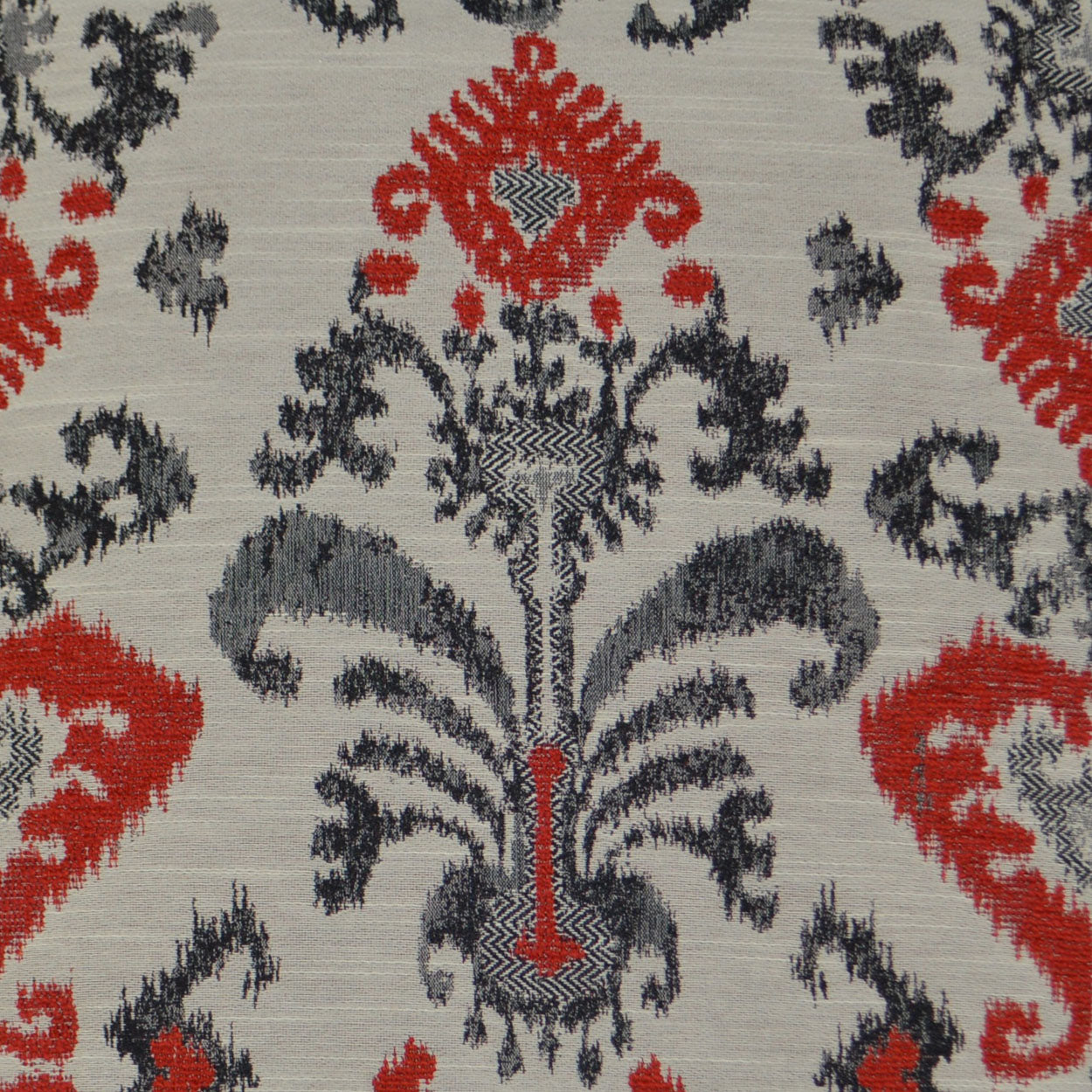 Damask-patterned fabric in red and navy on light beige, ornate arabesque motifs; decorative upholstery textile.