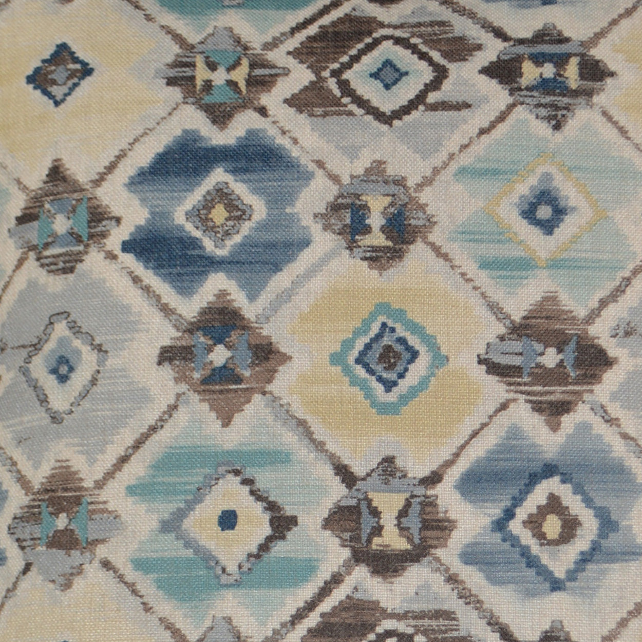Geometric diamond-patterned textile featuring blue, teal, beige and brown diamonds on ivory background.