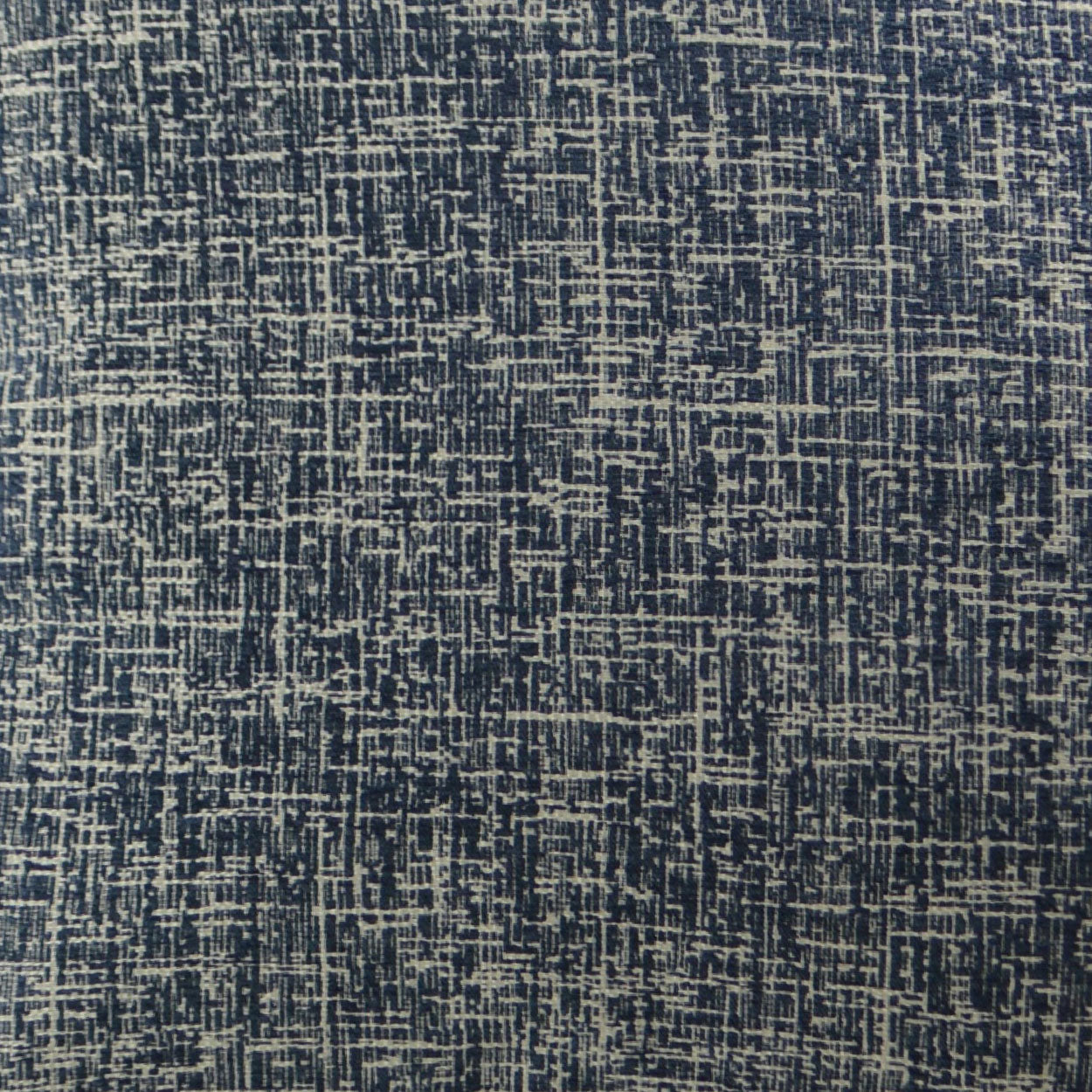 Navy blue fabric with beige irregular lattice weave; textured upholstery textile.