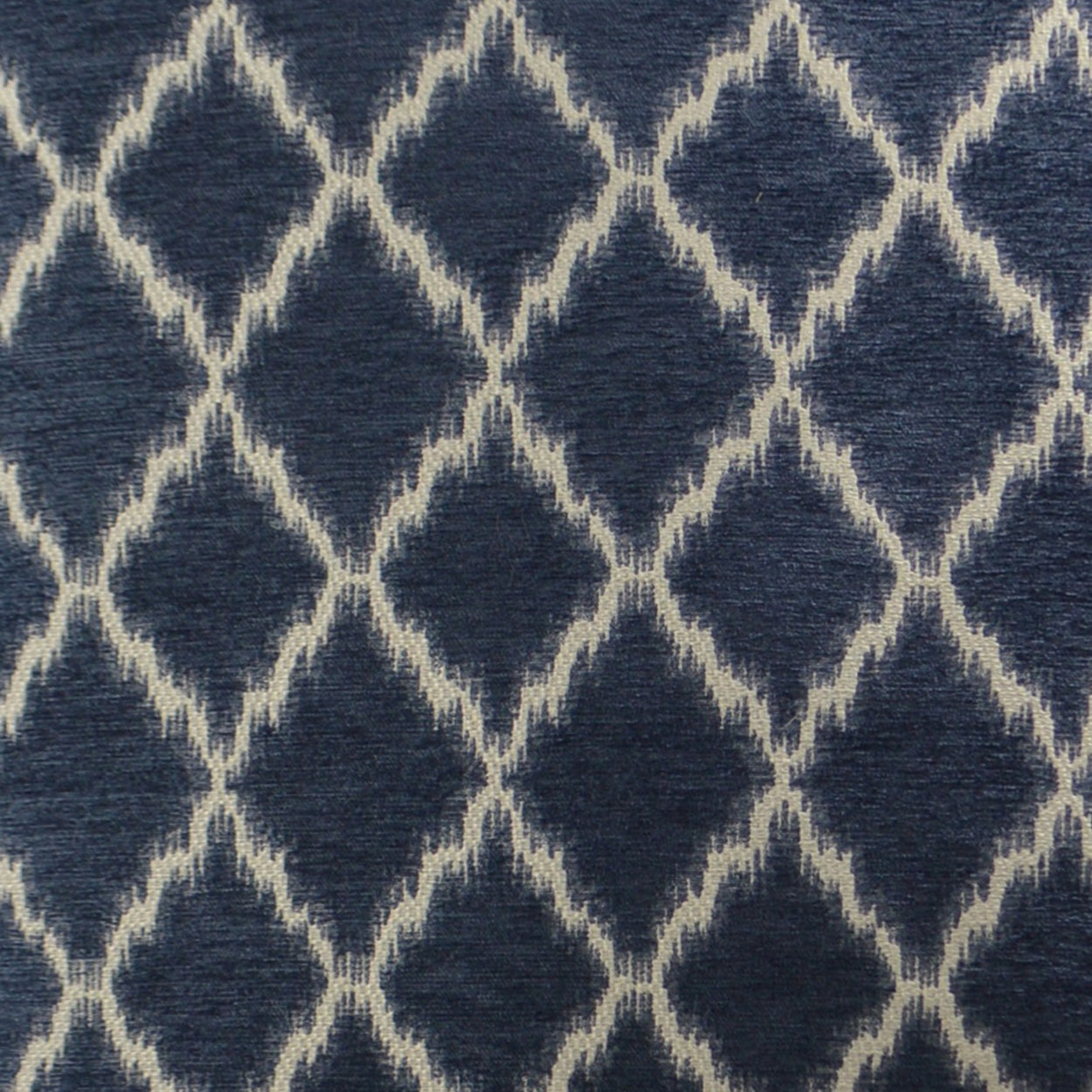Navy blue fabric with cream diamond lattice pattern; woven textile with a geometric trellis design.