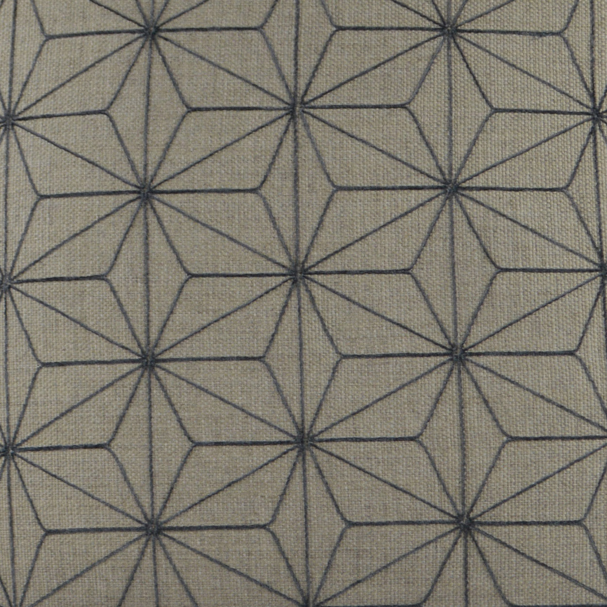 Taupe woven fabric with dark blue geometric star/diamond lattice; repeating hexagon rosettes for modern upholstery.
