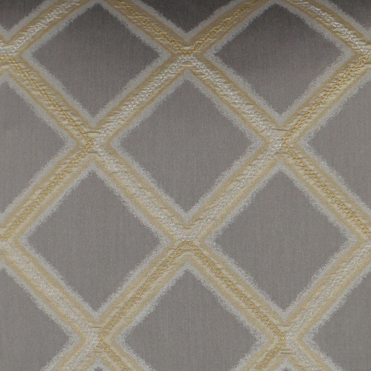 Grey fabric with gold diamond lattice embroidery; raised border pattern for upholstery or drapery.