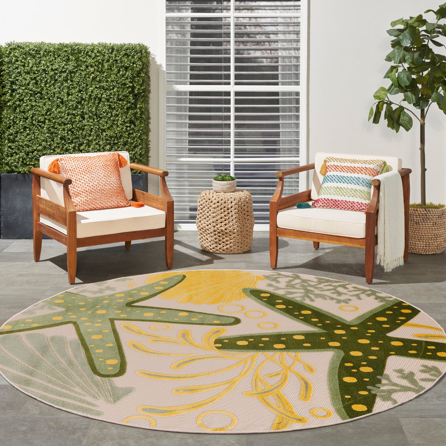 Outdoor round rug, 8 feet in diameter, with a yellow-green pattern on a patio.