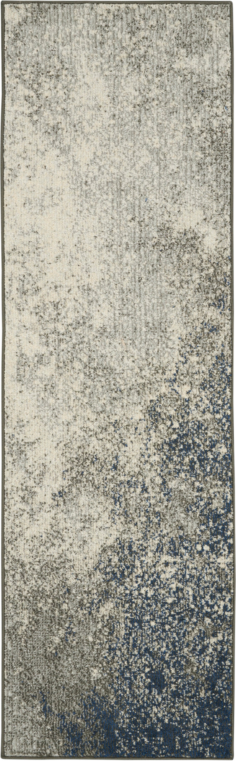 Rectangular runner rug with a distressed grayscale to navy blue gradient and speckled texture.