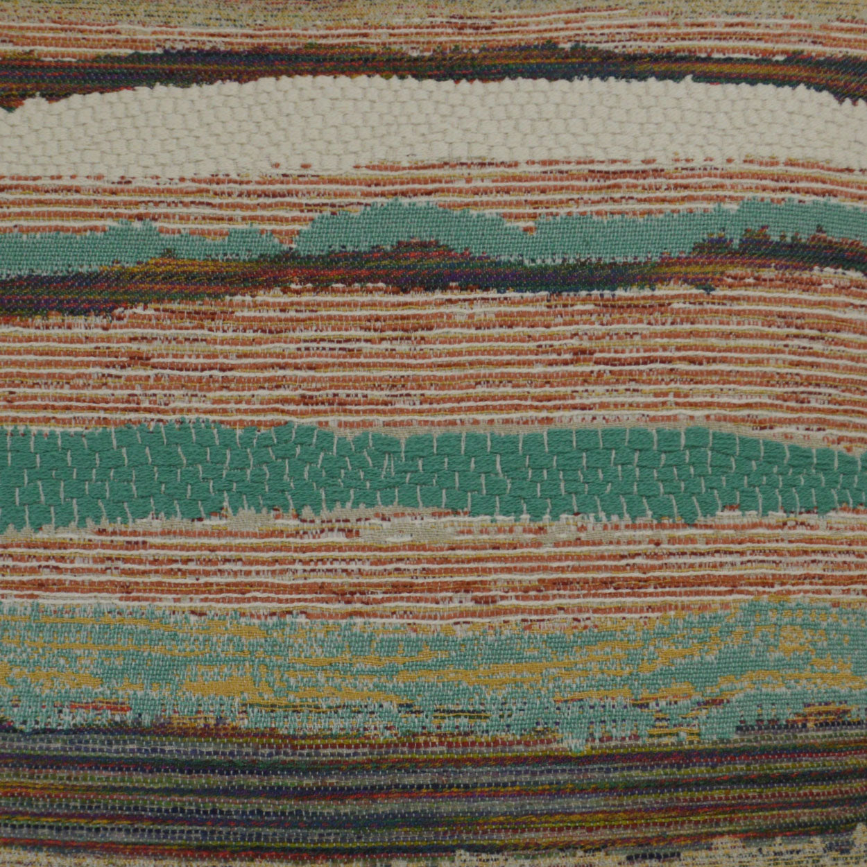 Close-up of a striped woven rug with teal, turquoise, orange, brown and cream bands; textured, boho textile.