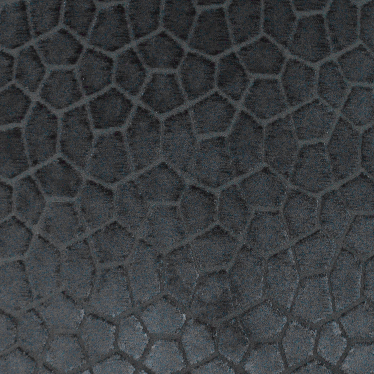 Dark charcoal fabric with irregular hexagonal pebble grain texture.