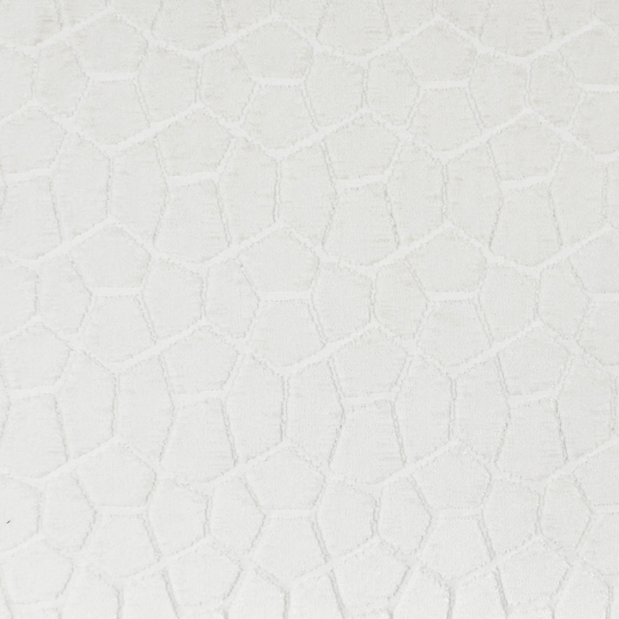 Cream fabric with an embossed irregular hexagonal pattern, textured upholstery material.