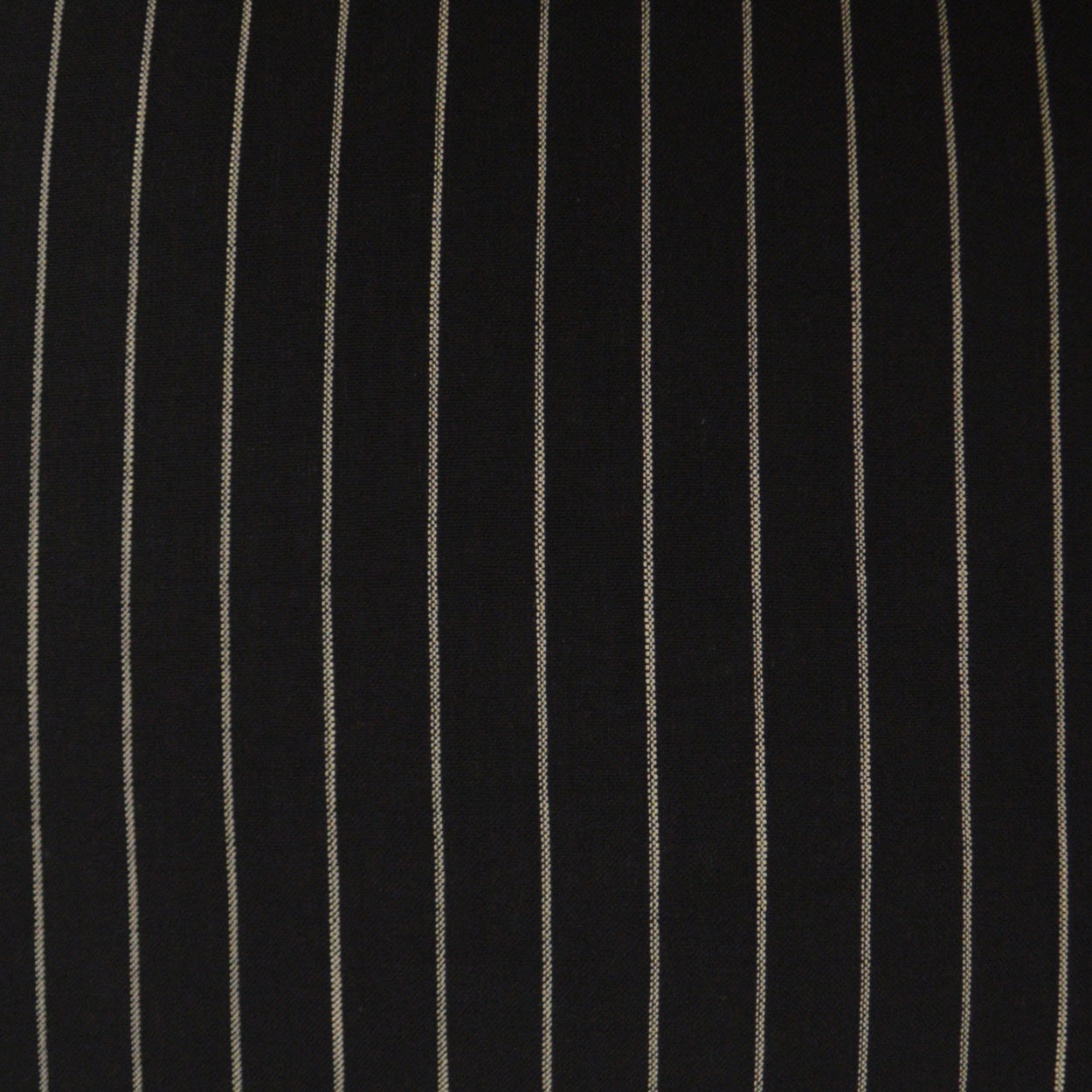 Black fabric with narrow white vertical pinstripes.