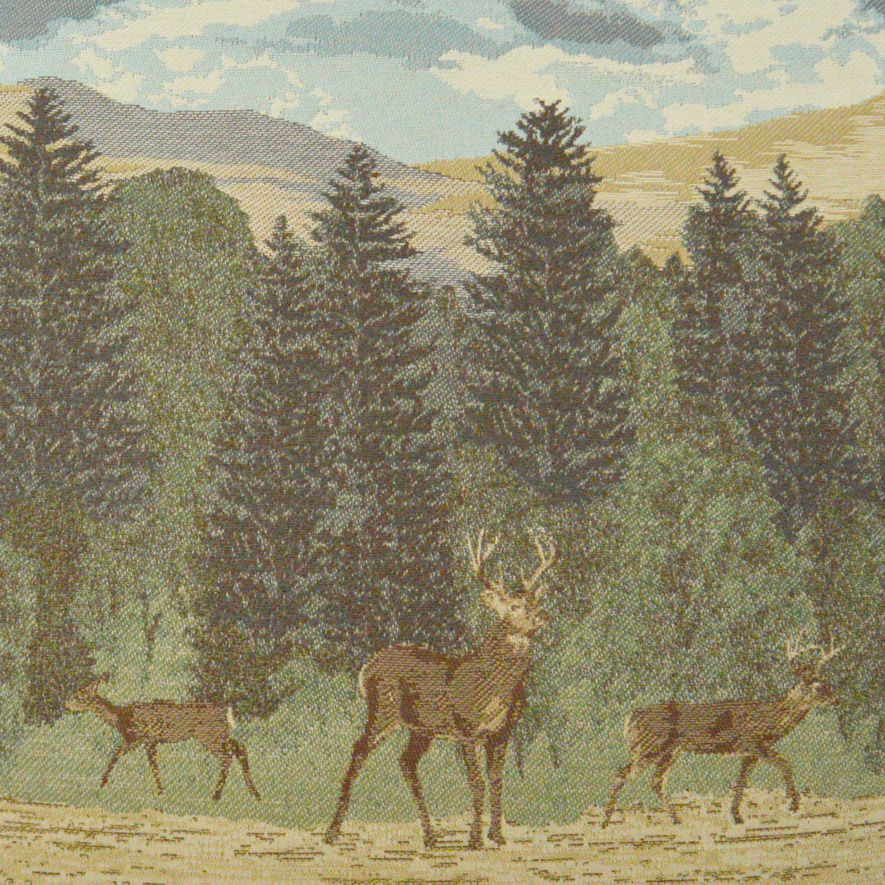 Brown deer roaming a pine forest with tall evergreen trees; vintage fabric print.