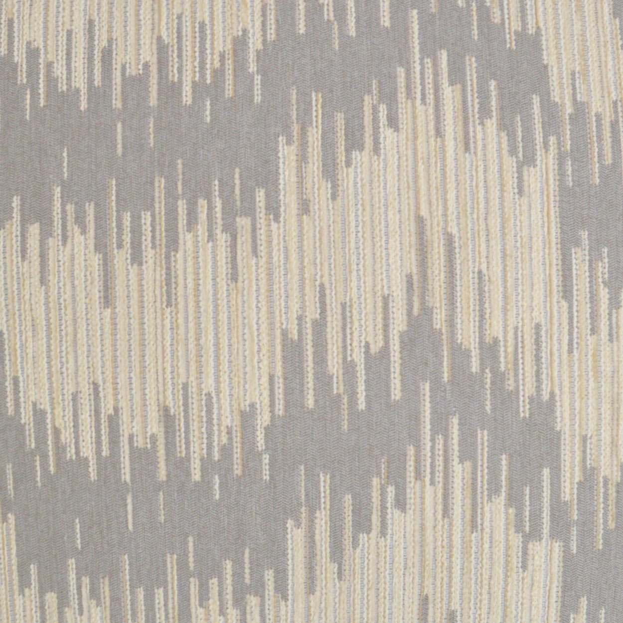 Grey & cream woven fabric with Ikat-style zigzag pattern; soft upholstery textile.