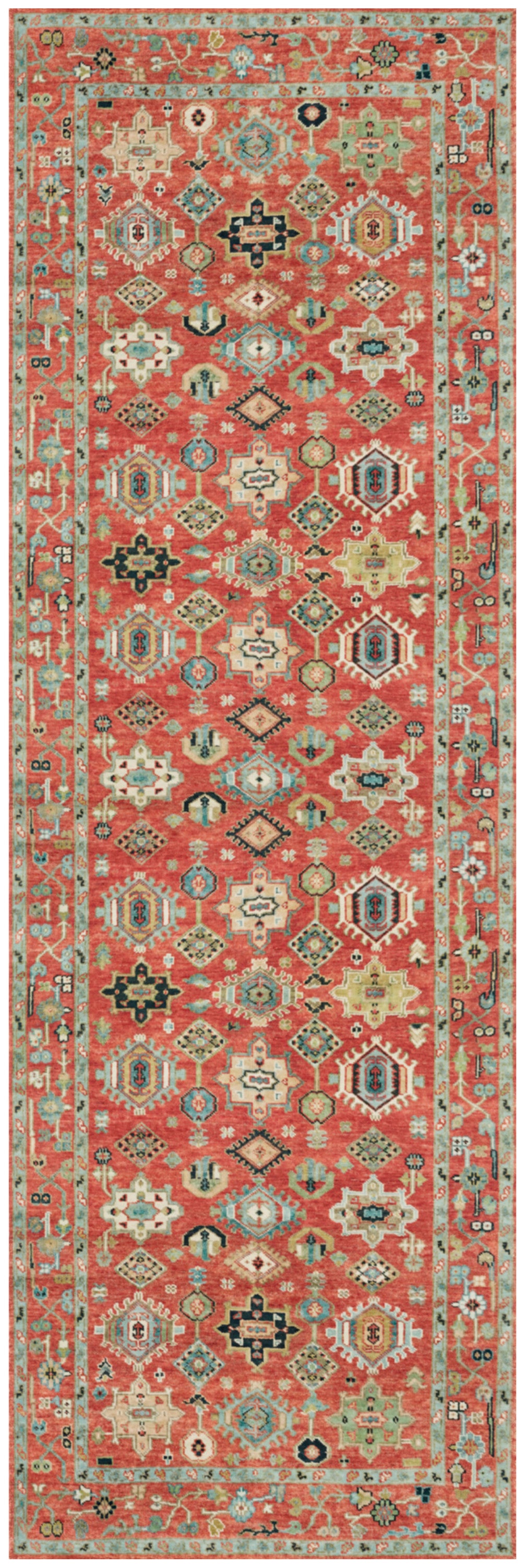 Long coral-red kilim-style runner rug with cream, teal, and black geometric motifs and a teal border