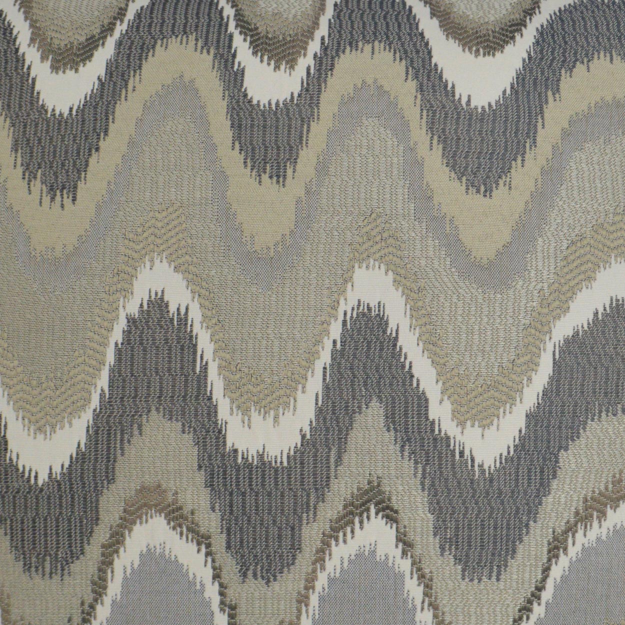 Neutral zigzag chevron woven fabric in beige, taupe, gray and cream tones with a textured pattern.