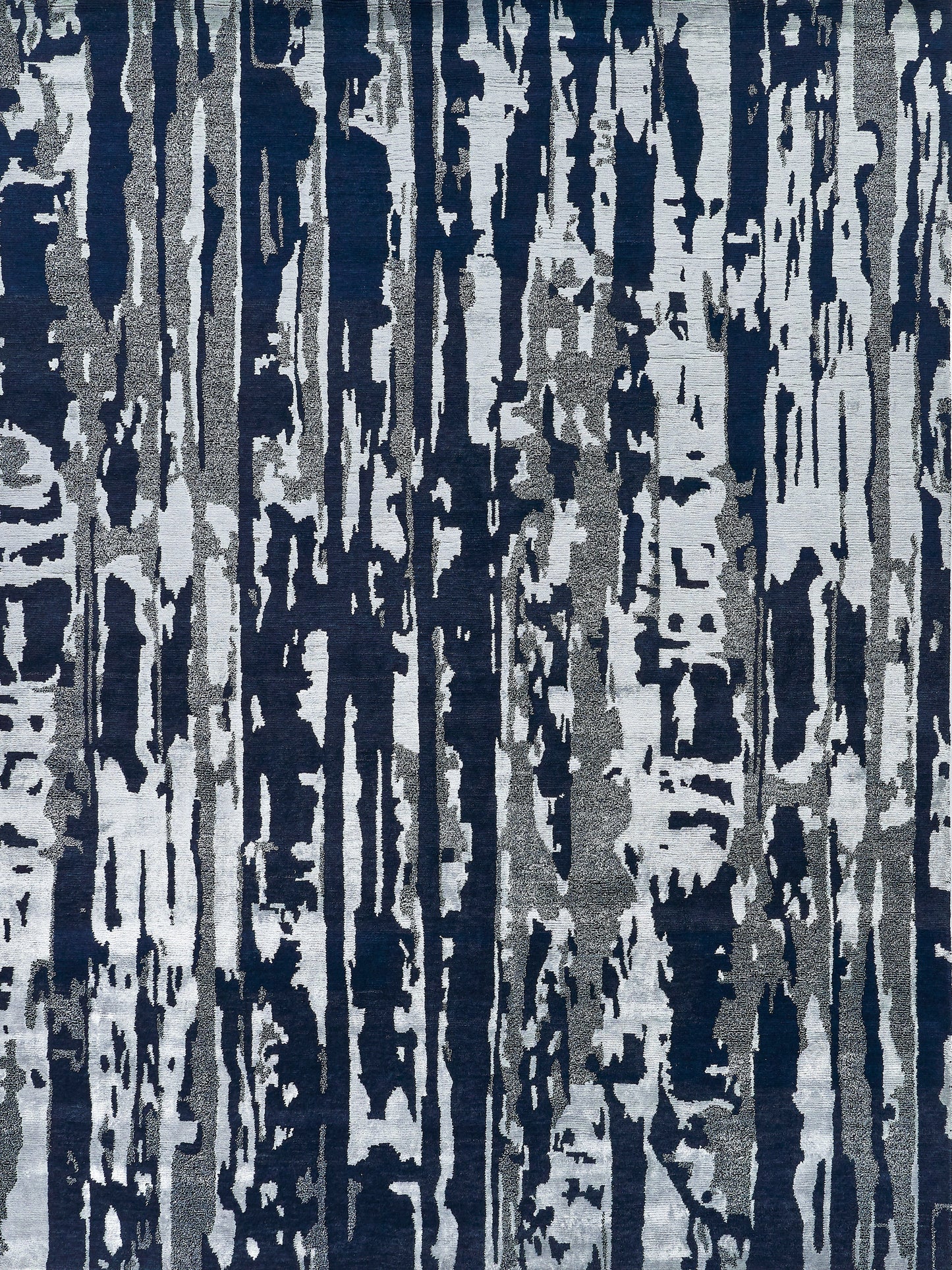 Abstract patterned rug in navy and gray with tree-bark texture for floor decor.