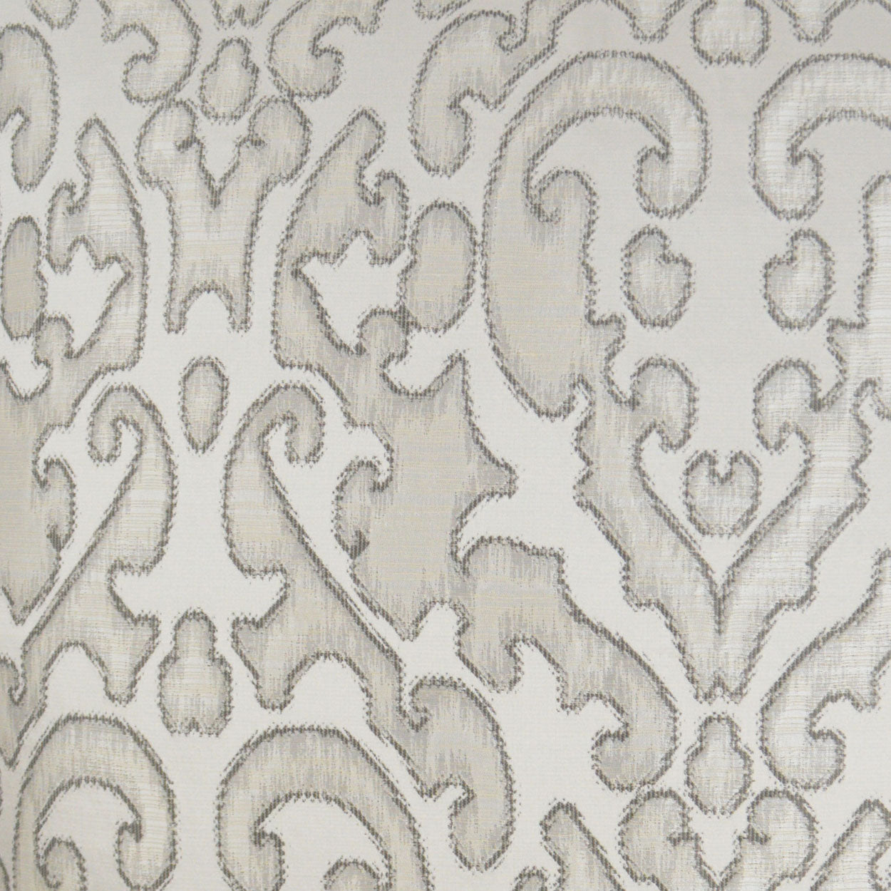 Beige fabric with subtle grey damask pattern; ornate scrolling motifs, jacquard texture for upholstery or drapery.