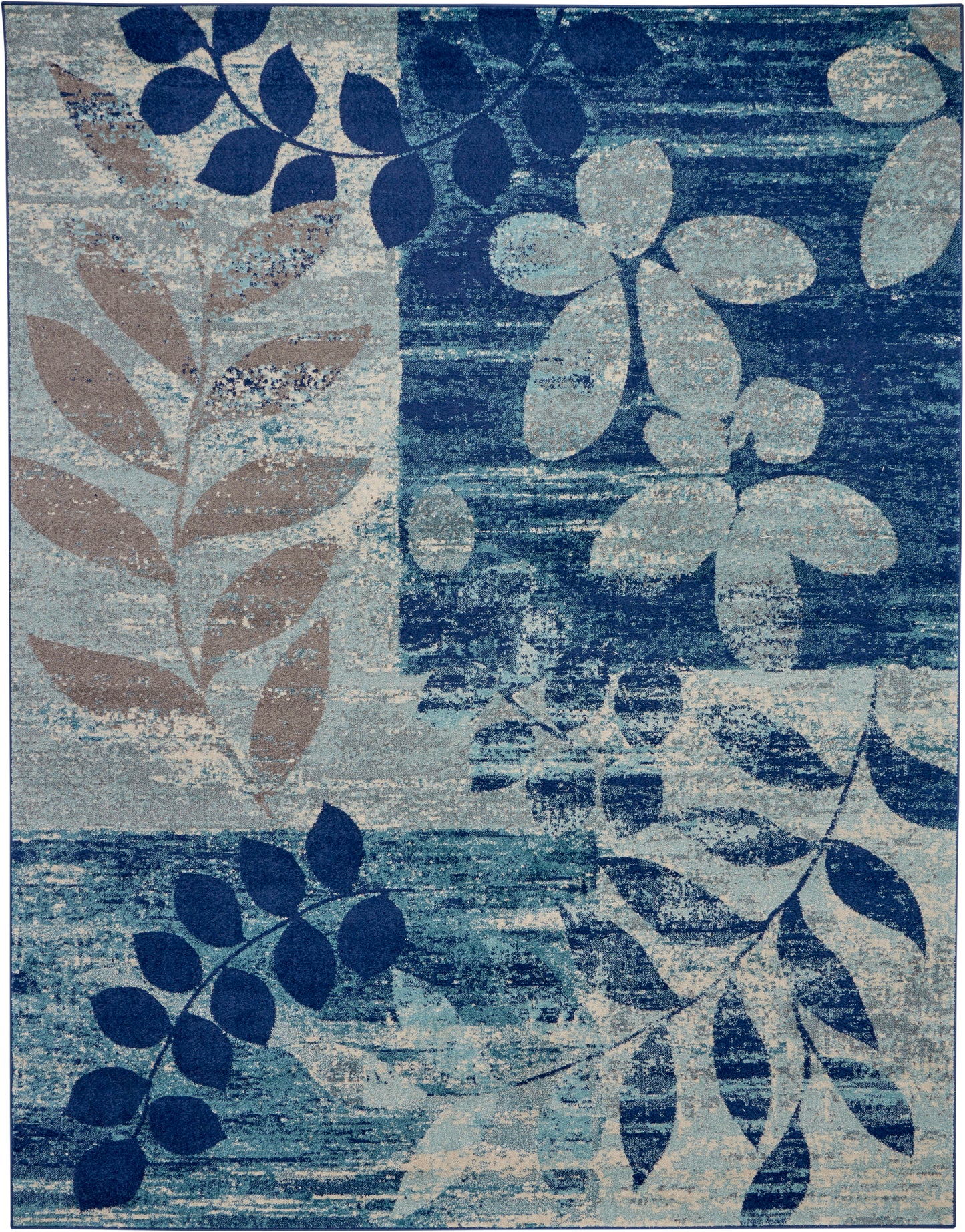 Abstract floral blue area rug with navy, teal and beige leaves; distressed texture.
