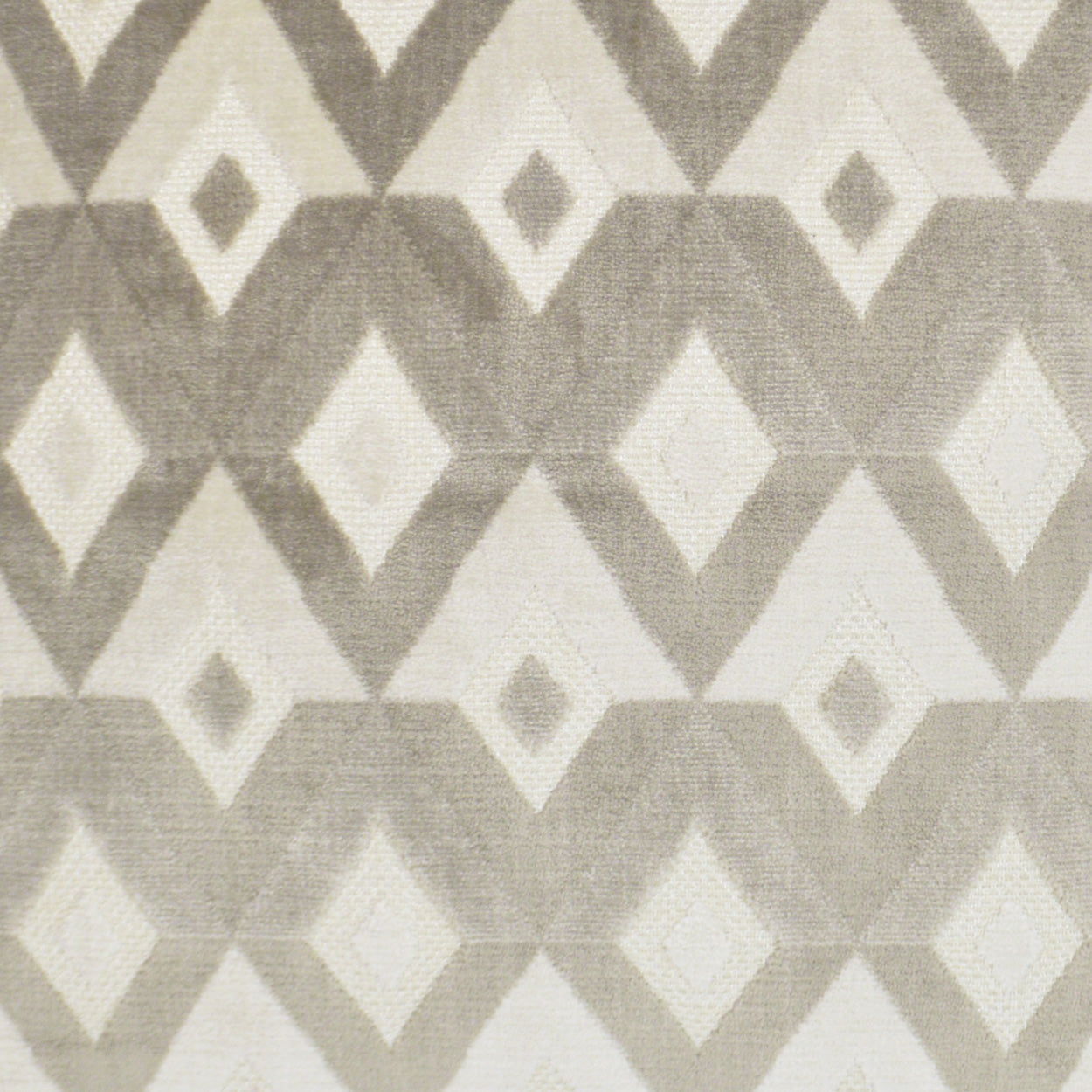 Geometric diamond-patterned fabric in beige and taupe with a soft woven texture.