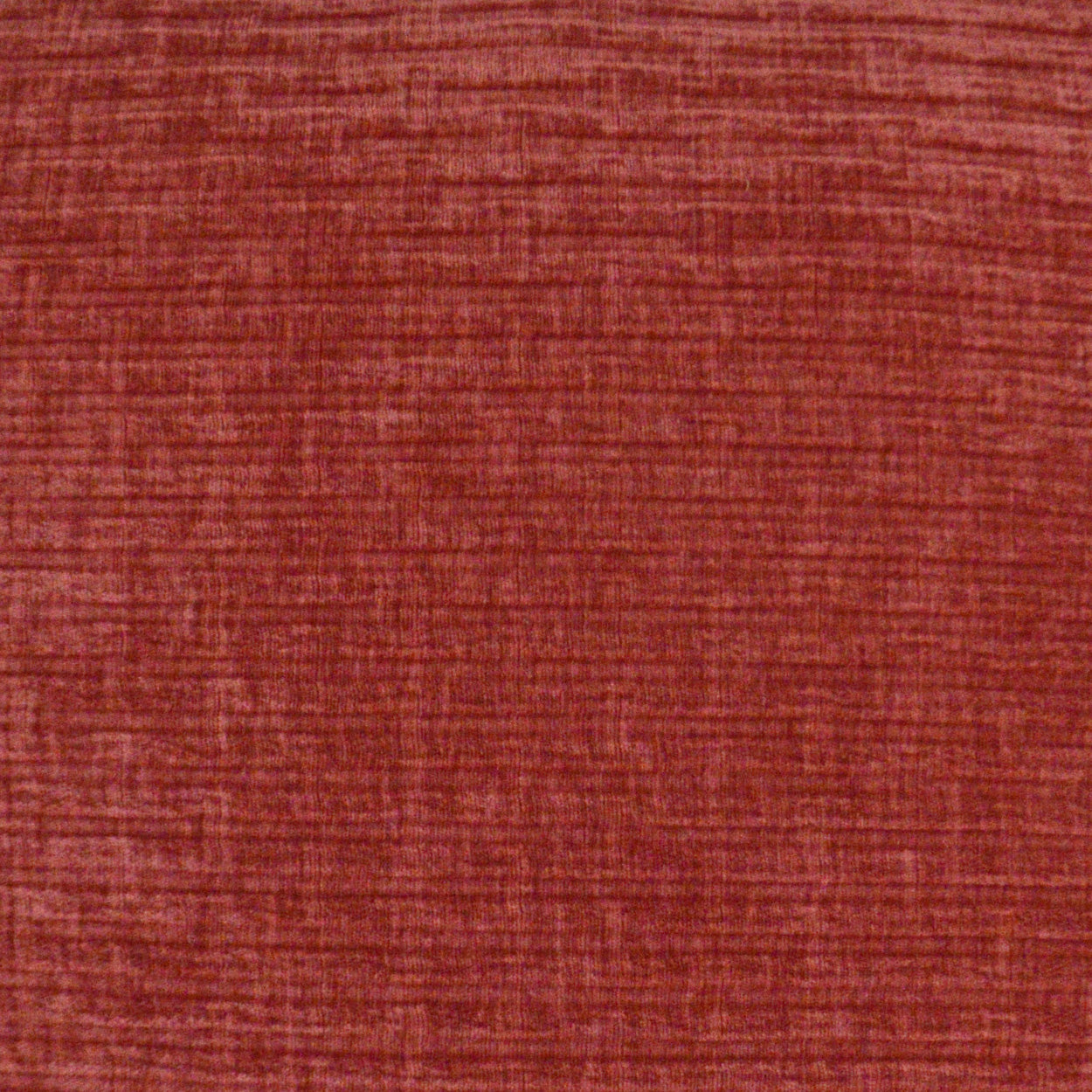 Rust red woven fabric texture with visible fibers; versatile upholstery or apparel swatch.