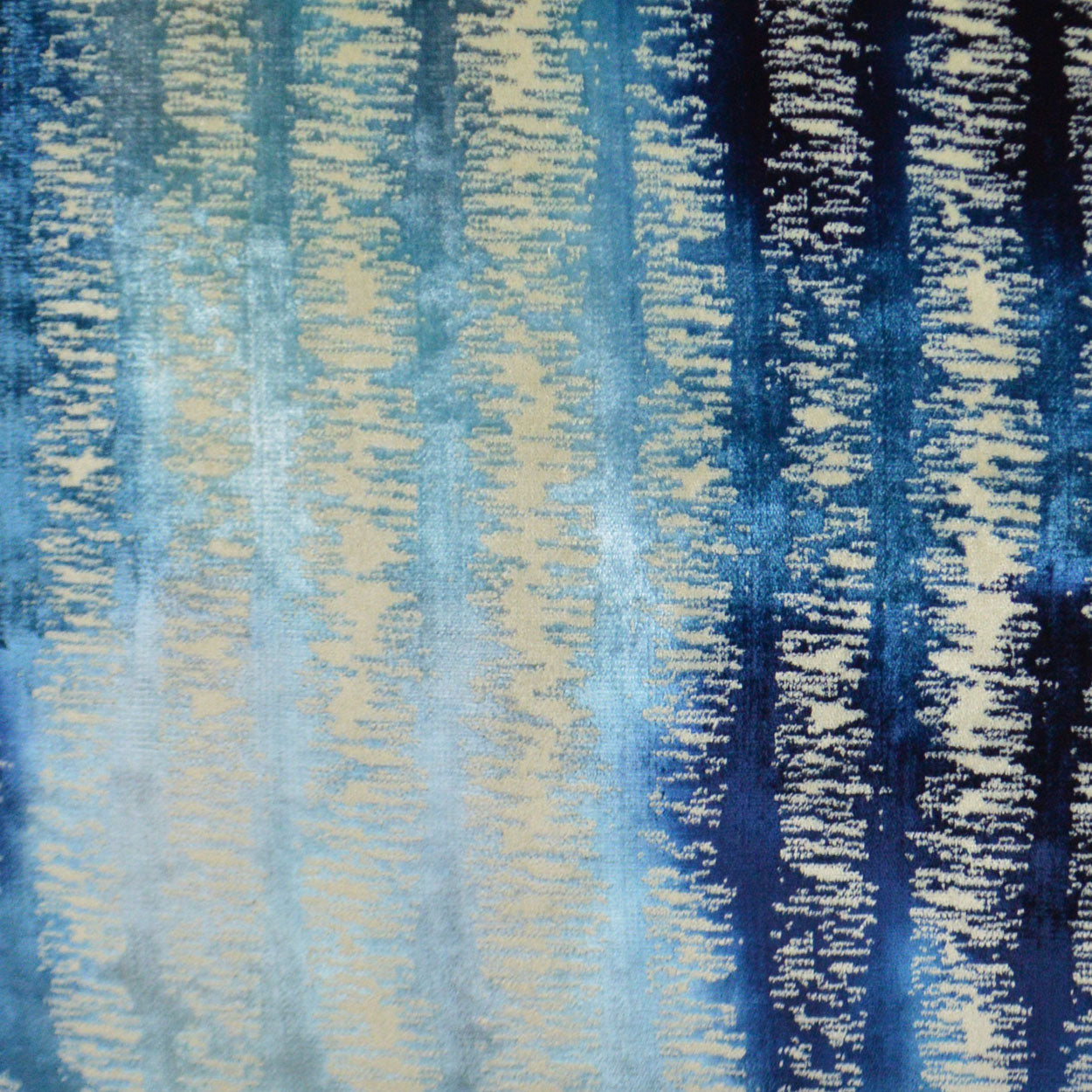 Textile fabric swatch with vertical blue & cream striped pattern.
