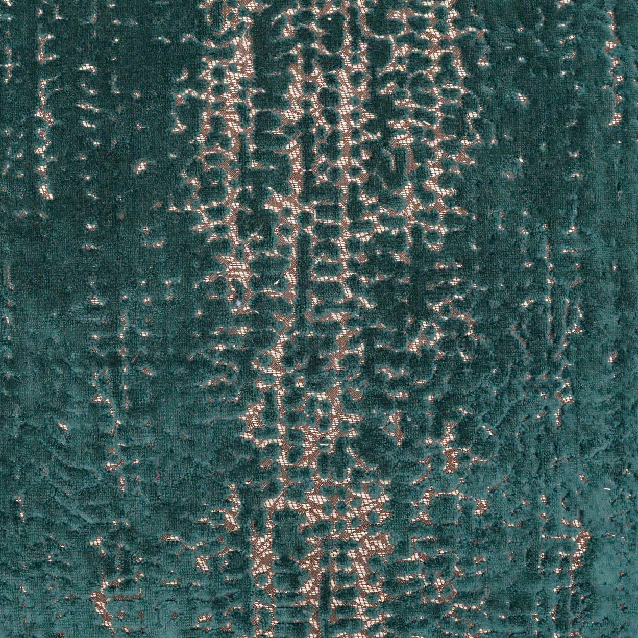 Teal velvet fabric with metallic gold-beige abstract pattern; luxe upholstery or drapery textile.