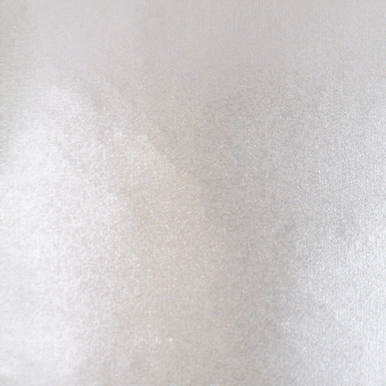 Close-up of light gray satin-like fabric with a soft sheen and smooth, fine texture.