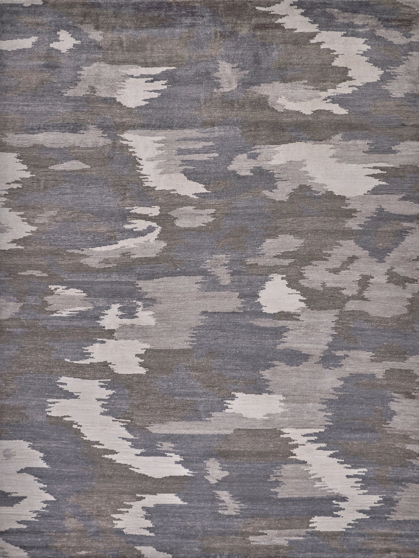 Hand-knotted rectangle rug with an abstract gray and beige pattern, 6' x 9', soft texture.