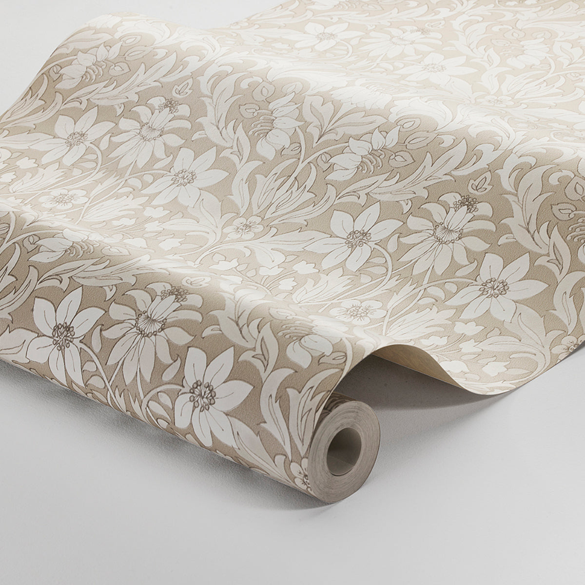 Beige wallpaper roll with cream floral damask pattern & flowing leaves; rolled edge reveals neutral botanical design.