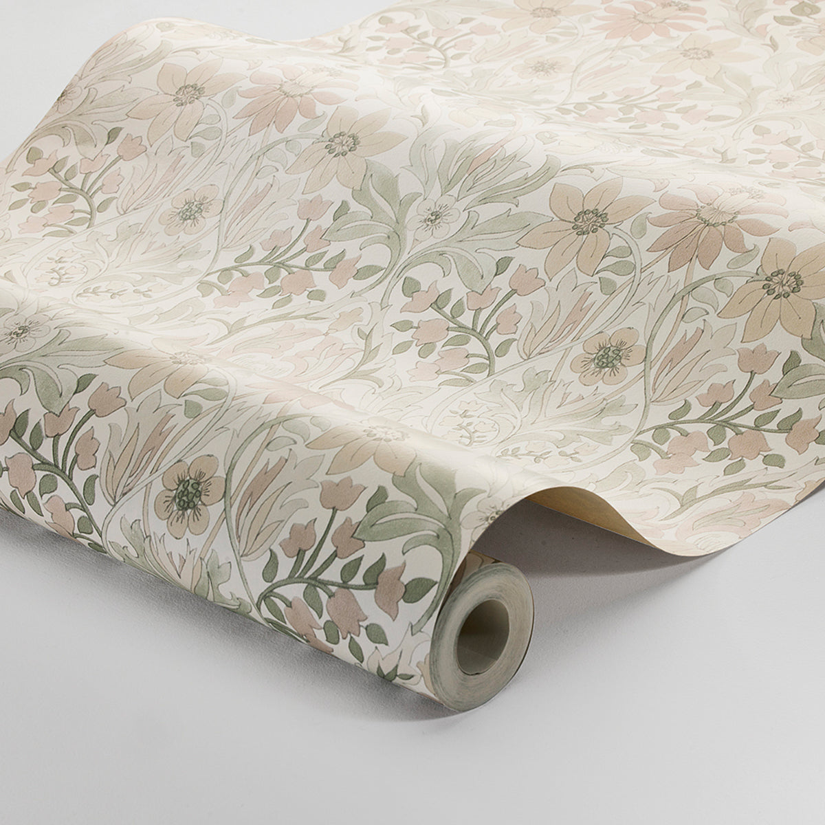 Rolled pastel floral wallpaper with cream background, pink and green botanical pattern, decorative wall covering.