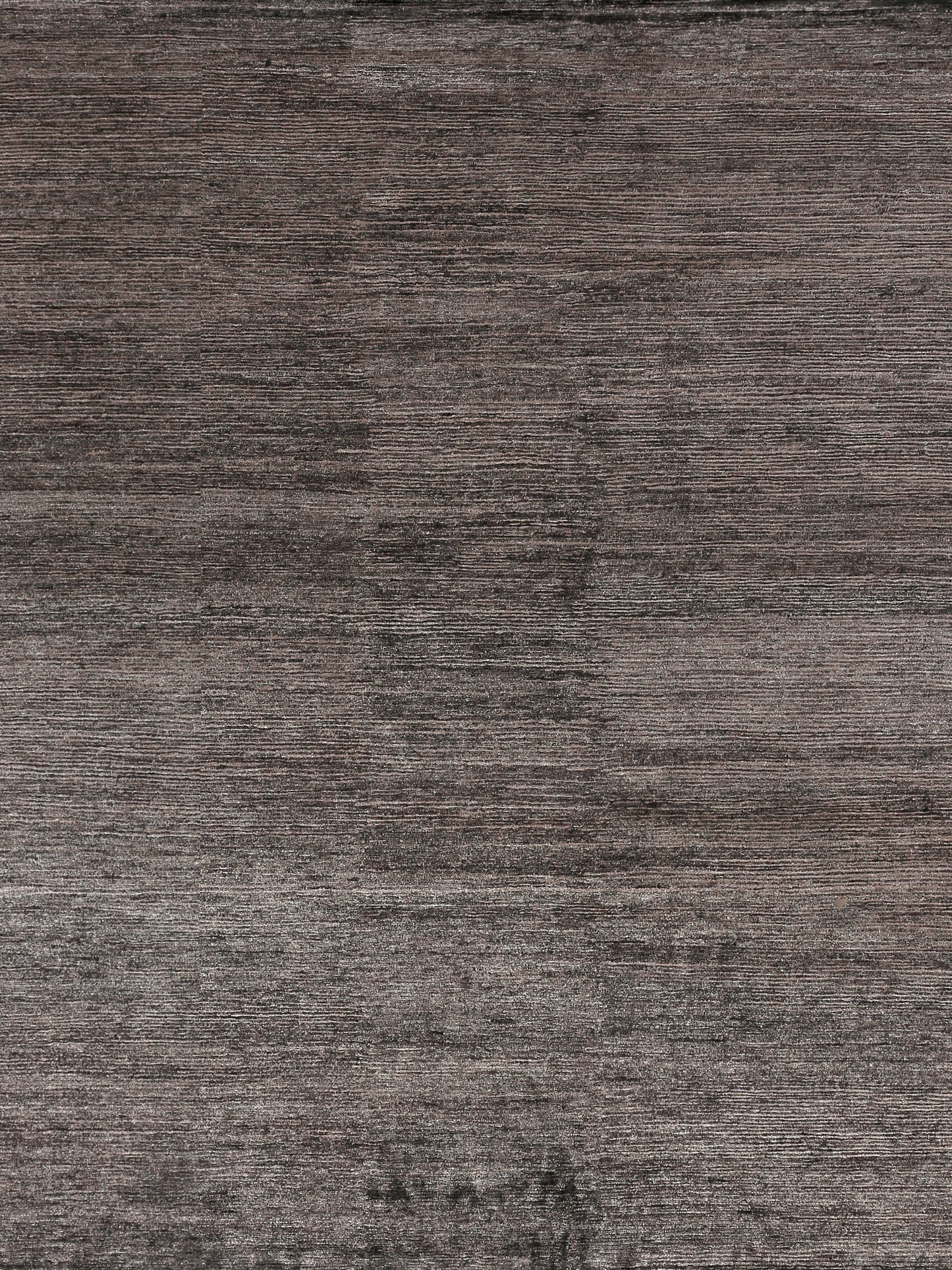Hand-knotted rectangle rug in varying shades of gray with a subtle gradient and linear pattern.