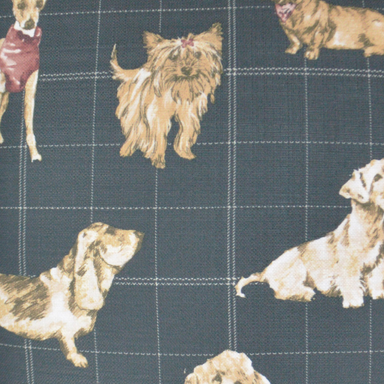 Dark blue fabric with white grid pattern and beige illustrated dogs in various poses.